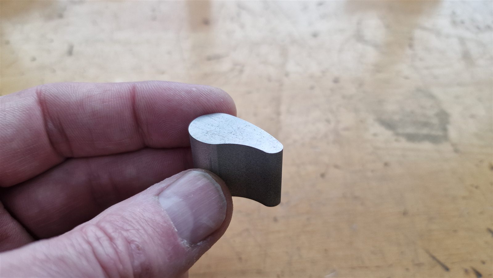 Small curved steel piece